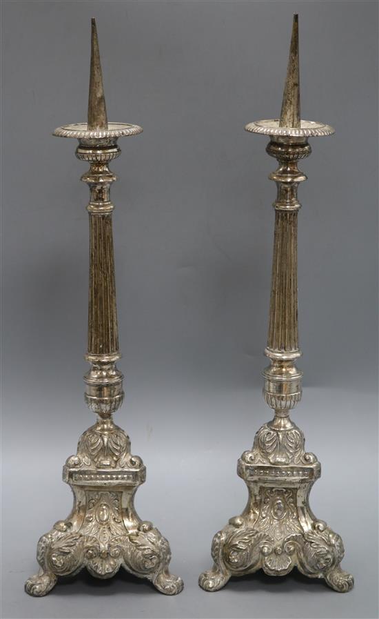 A pair of silver plated on brass pricket candlesticks height 55.5cm